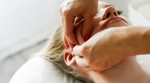 beautician cosmetologist makes lifting face massag 2023 11 27 05 31 59 utc